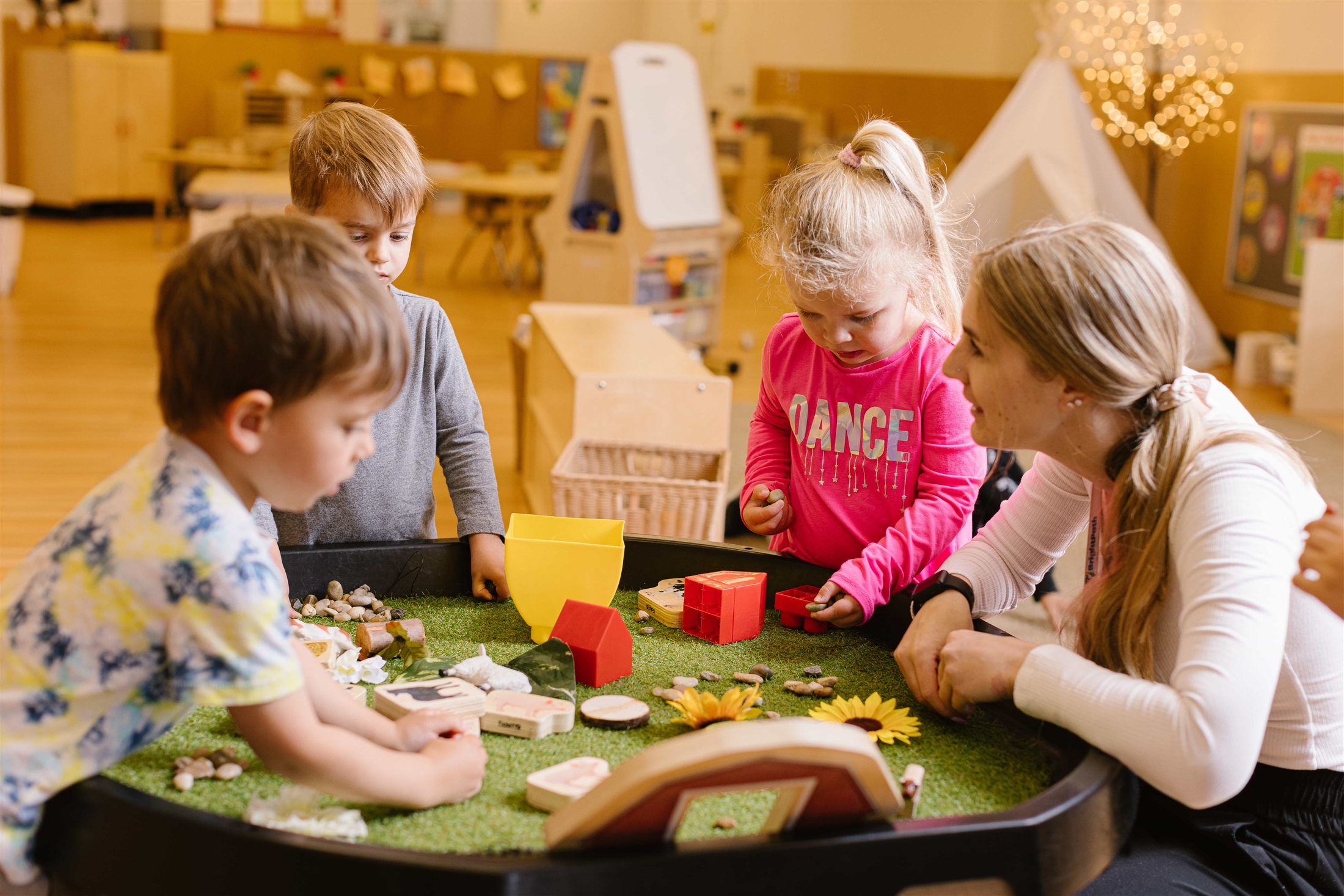 Children building language skills together in an inclusive early learning classroom