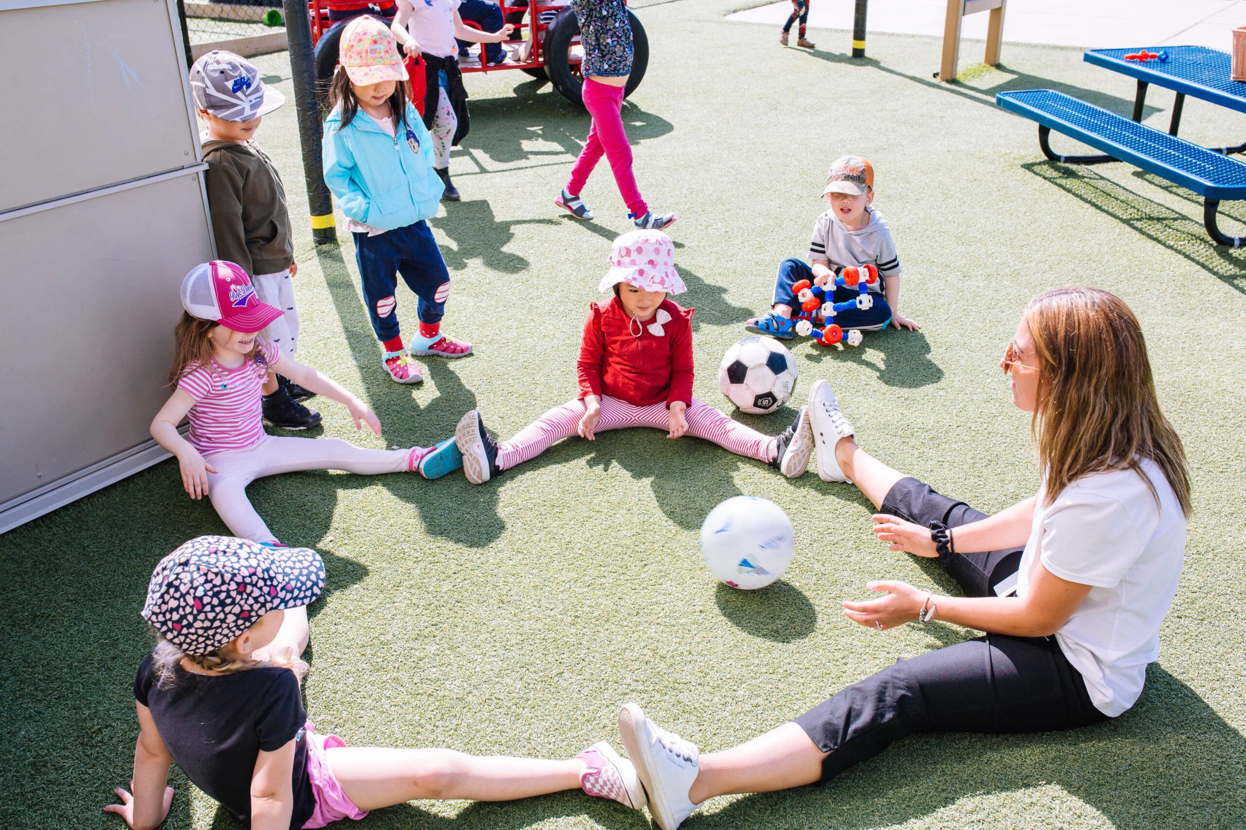 Child developing movement skills with support in an early learning centre