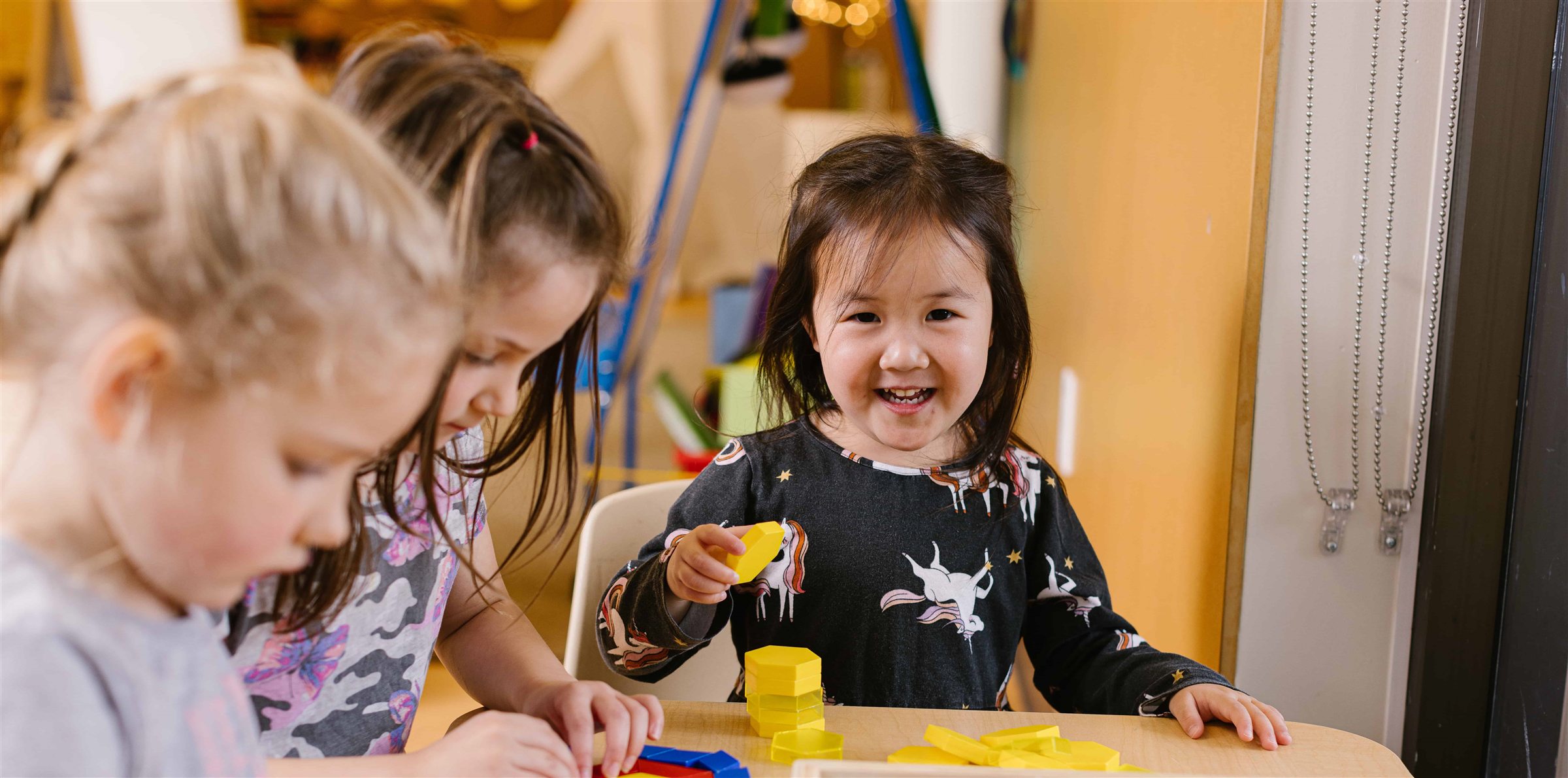 Children playing and learning together in a Marlborough Day Nursery classroom